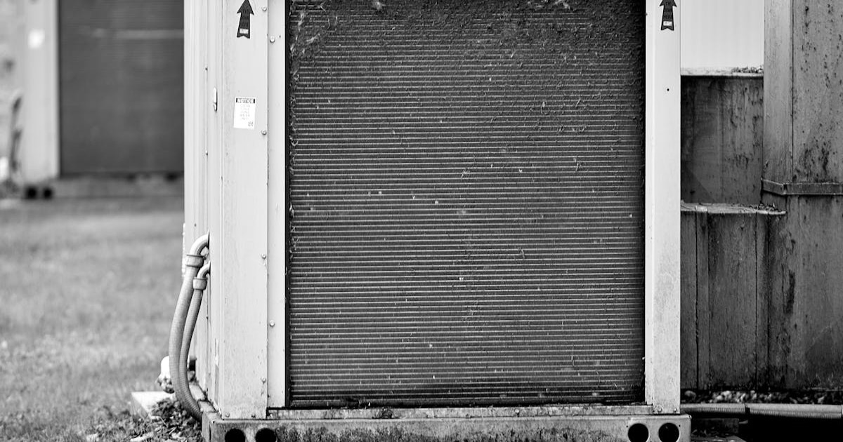 Close-up of an industrial HVAC unit outdoors, showcasing its metal texture.